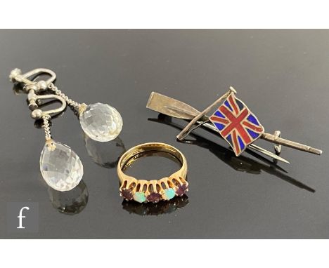 Three items of jewellery to include a 9ct opal and amethyst five stone ring, a pair of crystal drop earrings and a silver bro