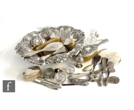 Five hallmarked silver backed hair brushes with a hallmarked silver backed hand mirror, thirteen assorted silver handled shoe