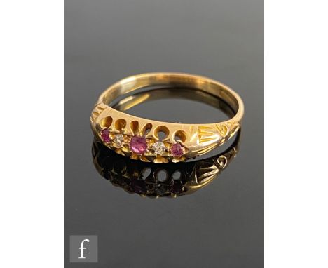 An early 20th Century 18ct ruby and diamond five stone boat shaped ring all to reeded shoulders, weight 2.7g, ring size M, st