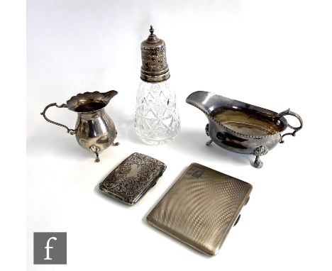 Five items of hallmarked silver, two cigarette cases, a cream jug, a sauce boat and a silver and cut glass sugar castor, tota