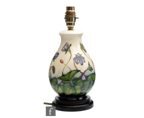 A Moorcroft Pottery lamp base decorated in the Hepatica pattern designed by Emma Bossons, with Moorcroft shade, printed mark,