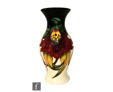 A Moorcroft Pottery vase decorated in the Anna Lily pattern designed by Nicola Slaney, impressed mark, boxed, height 19.5cm. 