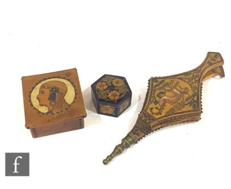 A pair of early 20th Century Arts and Crafts bellows decorated with a painted scene of a girl amidst foliage, the reverse wit