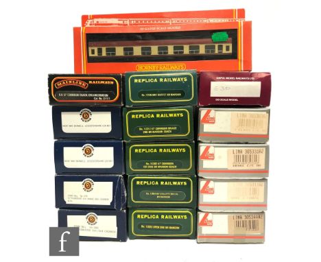 Eighteen assorted OO gauge passenger coaches by Hornby, Bachmann, Lima, Replica Railways and Dapol, all boxed. (18) 