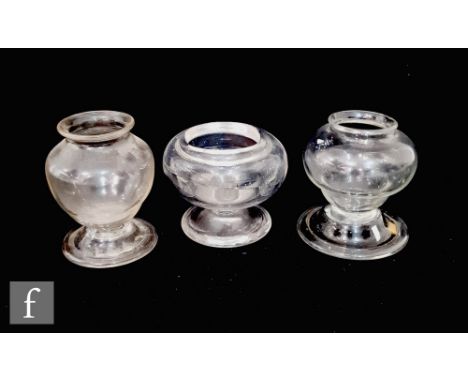 An 18th Century oil lamp of ovoid form with shallow collar neck, raised to a domed and folded foot, height 8.5cm, together wi