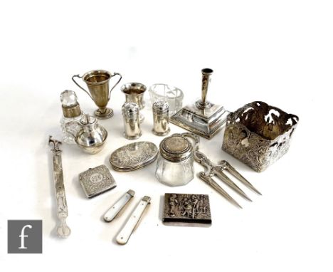 A parcel lot of assorted silver and other items to include a square bottle sleeve, a small trophy, salt and pepper pots, a ve