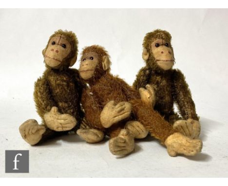 Three British monkeys, two in brown mohair, one in cinnamon, each with felt faces, hands and feet, black boot button eyes and