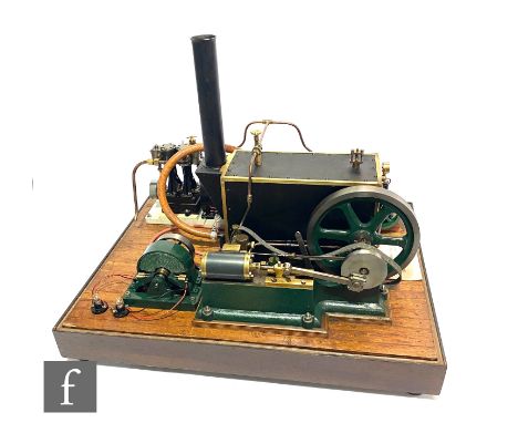 A stationary steam plant with coal fired boiler and horizontal and vertical engine driven generators, fly wheel diameter 7.5"