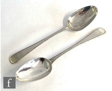 A pair of George III hallmarked silver table spoons with beaded borders, engraved initials to terminals, weight 4oz, London 1