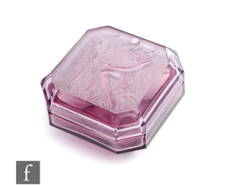 A 1930s Czechoslovakian pressed glass trinket box by Heinrich Hoffman, of square section with canted corners, the cover relie