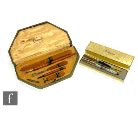 A 1930s Art Deco Monte Rosa desk set comprising letter opener, dip pen, pencil, seal and lead sharpener tool, each with butte