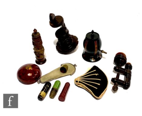 A small collection of assorted sewing related collectables to include two Victorian treen clamps with velvet pin cushions, a 