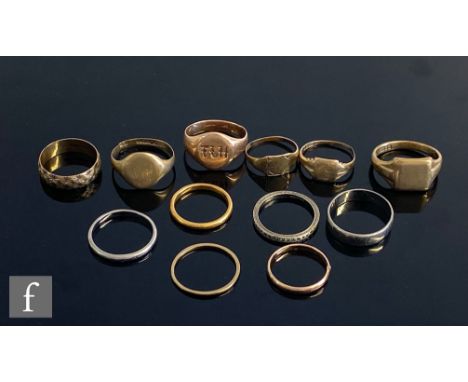 Eight 9ct rings to include signet and wedding examples, total weight 24g, an 18ct white gold wedding ring, weight 4g, a 22ct 