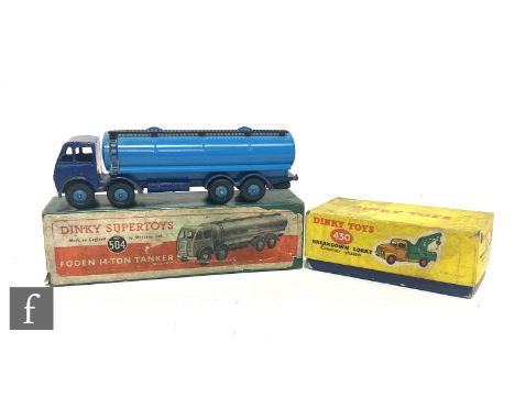 A Dinky Toys 504 Foden 14 Ton Tanker with first type cab with dark blue cab and chassis and mid blue back, flash and ridged h