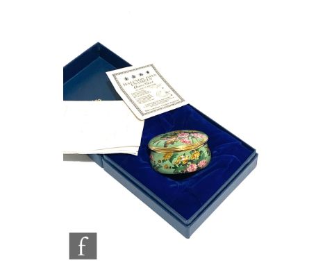 A boxed Halcyon Days Enamels Autumn Flowers quartz clock inspired by the painting on a Chinese enamel bowl of the Qianlong pe