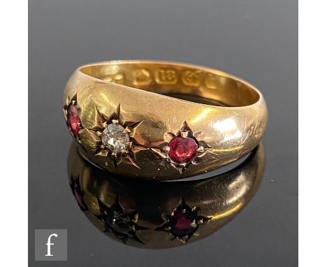 An early 20th Century 18ct hallmarked three stone ruby and diamond ring gypsy set stones to a plain head, weight 2.3g, ring s