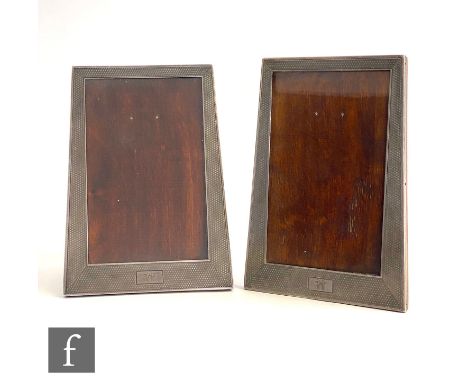 A pair of Art Deco hallmarked silver tapering rectangular easel photograph frames each with initials to a plain cartouche and