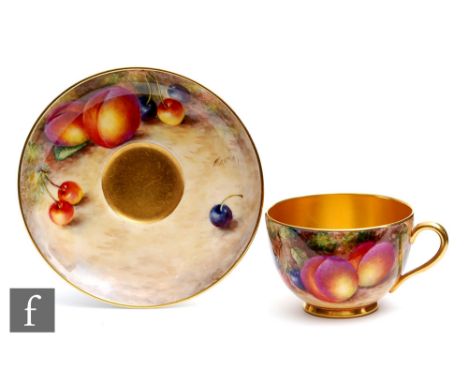A Royal Worcester Fallen Fruits cup and saucer decorated by Freeman with hand painted peaches and cherries, both pieces signe