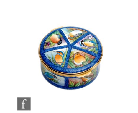A Moorcroft Enamels circular trinket box decorated with hand painted British birds (robin, kingfisher, duck, blue tit and a b