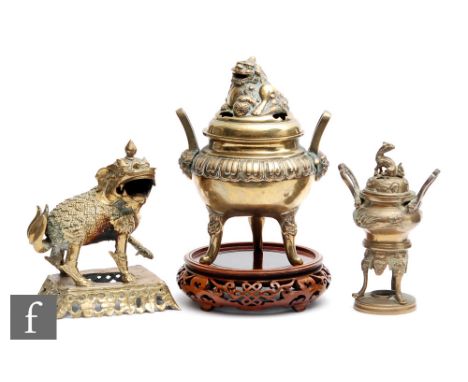 A collection of Chinese late Qing Dynasty censers, to include a tripod bombe form example with pierced shishi cover, height 2