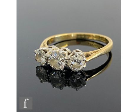 An 18ct diamond three stone ring, brilliant cut claw set stones, total weight of stones approximately 0.80ct, weight 2.8g, ri