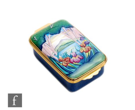 A Moorcroft Enamels rectangular trinket box decorated with hand painted flag iris before a mountainous landscape, printed mar