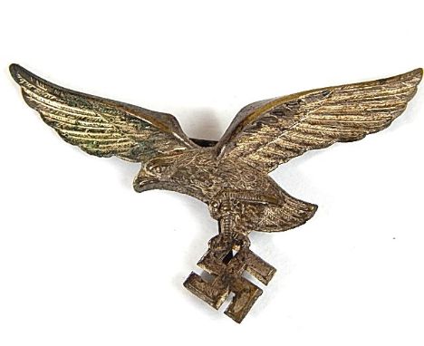 GERMAN LUFTWAFFE VISOR CAP EAGLE DEVICE  of typical light metal stamped construction