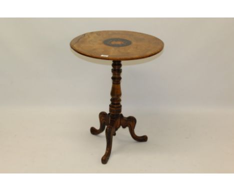 Victorian walnut occasional table, the figured veneered circular top centred by floral medallion, on turned column and carved