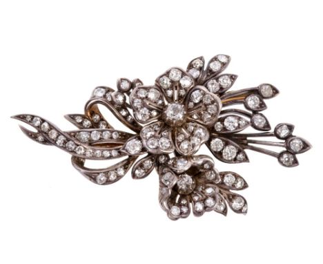 Victorian diamond floral spray brooch with two flower-heads and foliate sprays tied with a ribbon, set throughout with old cu