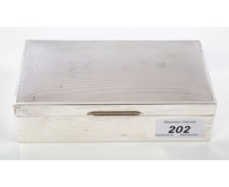 Contemporary silver cigarette box of rectangular form, hinged cover with engine-turned decoration and cedar-lined interior (B