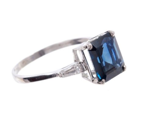 Sapphire and diamond ring with a rectangular step cut sapphire, estimated to weigh approximately 2.44 carats, with a tapered 