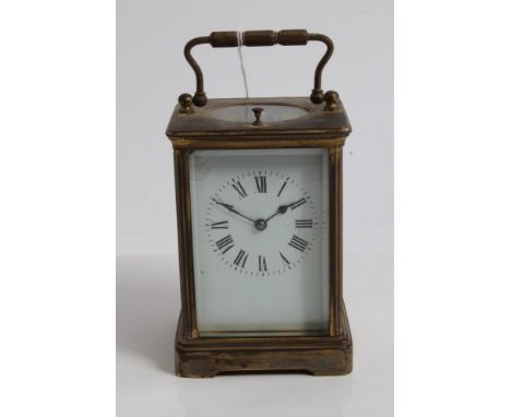 Late 19th / early 20th century French carriage clock with eight day repeat movement striking on a gong, white enamel dial wit