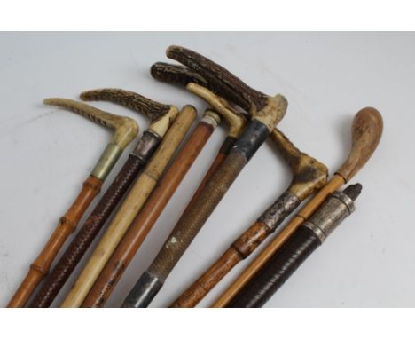 Four early 20th century silver mounted hunting whips and five others (9)