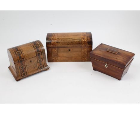 Victorian inlaid walnut dome-topped tea caddy with parquetry inlaid bands, two interior lidded compartments, on bun feet, 20c