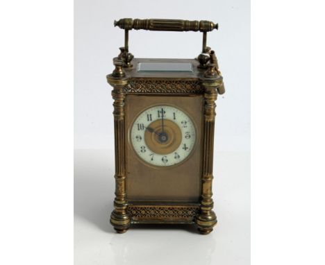 Late 19th century French carriage clock with eight day timepiece movement and cylinder escapement, gilt metal dial with white