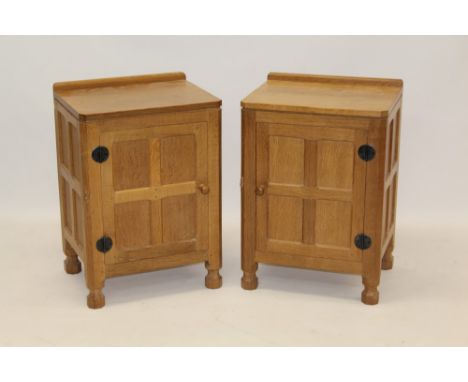 Robert 'Mouseman' Thompson of Kilburn, pair of oak bedside cabinets, each with square adzed top with rear gallery enclosed by