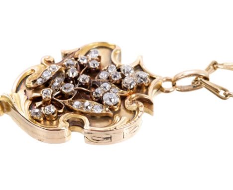 Antique diamond set locket with a Baroque shield-shaped plaque applied with old cut diamonds in a floral design, hinged openi
