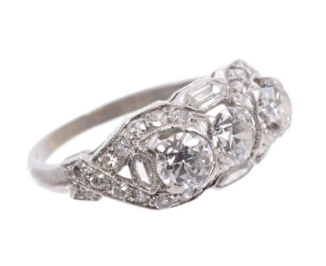 1920s Art Deco diamond three stone ring with three old cut diamonds in openwork border, set with trapeze cut and single cut d