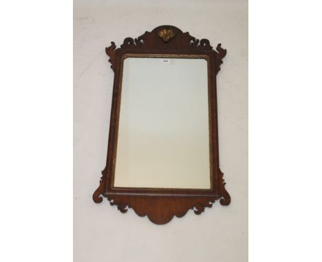 George III mahogany fret carved wall mirror, the rectangular plate in gilt slip with re-entrant angles and fret surround, sur