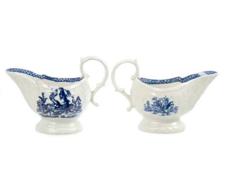 Two 18th century English blue and white sauce boats - possibly Liverpool, with moulded scroll cartouches and printed bird and