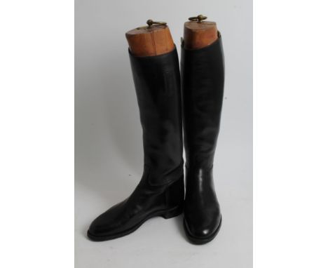 Pair of gentlemen's black leather hunting boots with wooden trees, approximately size 10