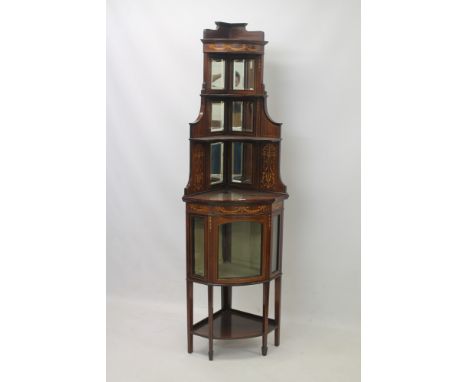 Edwardian rosewood and marquetry standing bow front corner cupboard with stepped arrangement of open shelves with mirror back