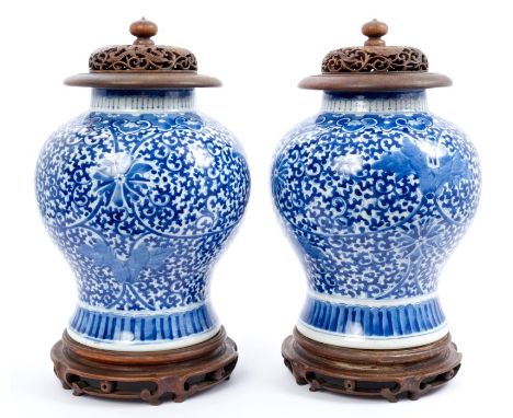 Pair 19th century Chinese export blue and white porcelain baluster-shaped vases with painted floral scroll decoration and dou