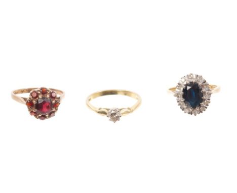 Gold (18ct) diamond single stone ring, gold (9ct) diamond and sapphire cluster ring and gold (9ct) garnet cluster ring (3)