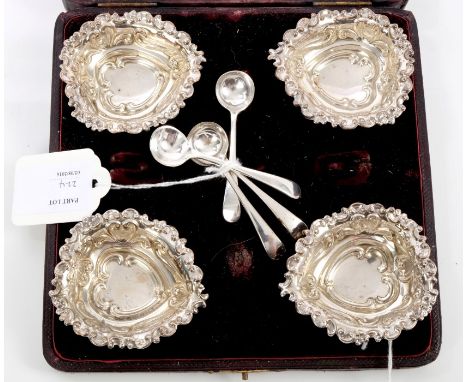 Set of four late Victorian silver salts of heart-shaped form, with scroll and bow decoration, on three ball feet, in a fitted