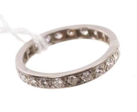 Diamond eternity ring with a full band of twenty-three brilliant cut diamonds.  Ring size S CONDITION REPORT Would benefit fr