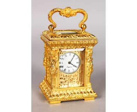 A MINIATURE CAST METAL CASE FANCY CARRIAGE CLOCK. 8cms high.