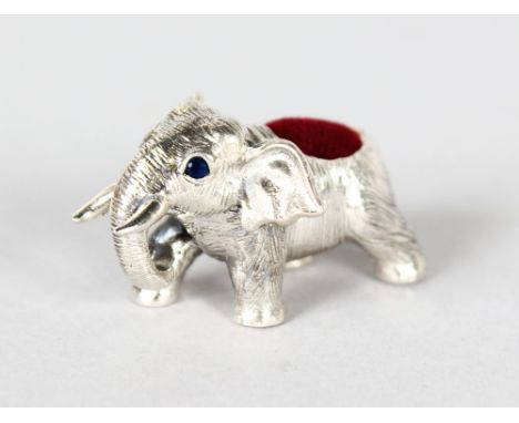A MINIATURE SILVER ELEPHANT PIN CUSHION.