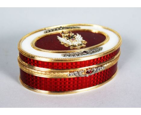 A SUPERB RUSSIAN SILVER GILT AND ENAMEL OVAL BOX AND COVER, the top with eagle motif, cabochon, rubies and diamonds, the top 