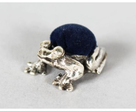 A MINIATURE SILVER FROG PIN CUSHION.